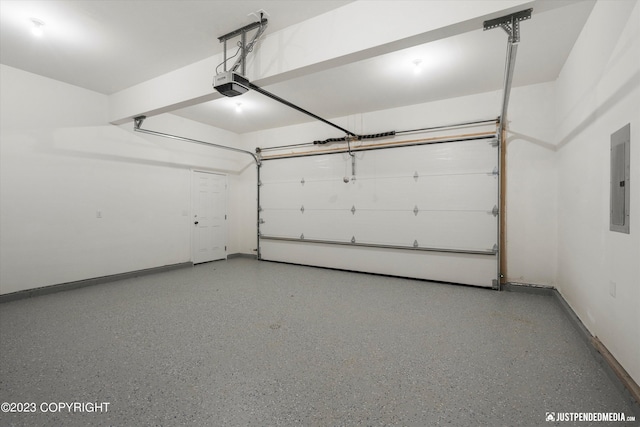 garage featuring a garage door opener, baseboards, and electric panel