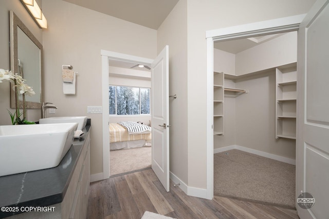 bathroom featuring vanity and wood-type flooring