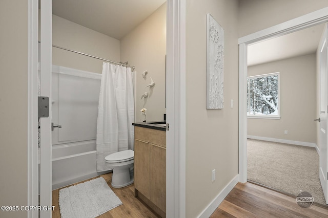 full bathroom with wood-type flooring, vanity, toilet, and shower / bathtub combination with curtain