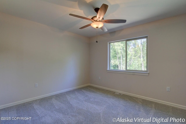 carpeted empty room with ceiling fan