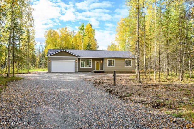 L12 Jasmine Rd, Chugiak, AK 99567 - view of front facade with an attached garage and gravel driveway
