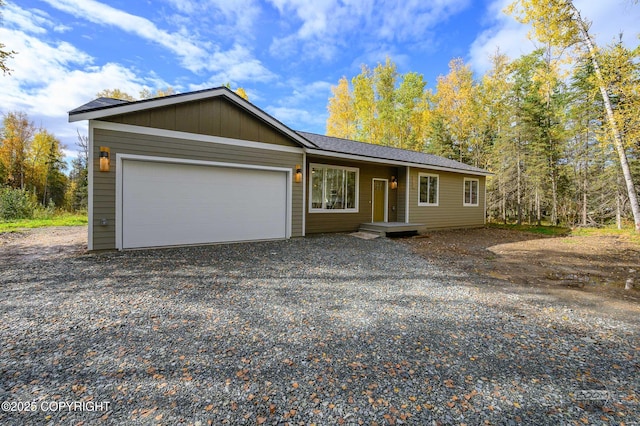 L12 Jasmine Rd, Chugiak, AK 99567 - view of front of house featuring gravel driveway and a garage
