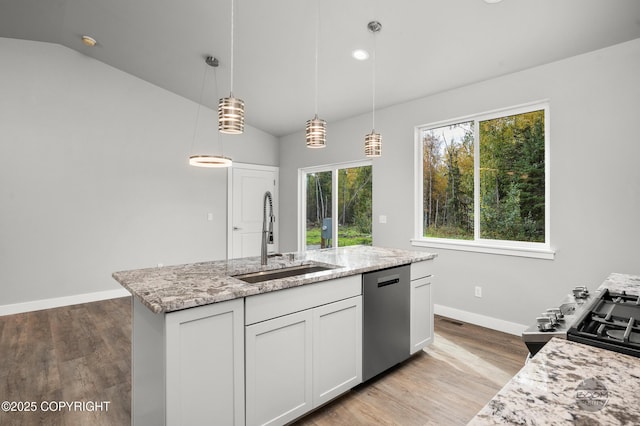 L12 Jasmine Rd, Chugiak, AK 99567 - kitchen with stainless steel appliances, a sink, lofted ceiling, light stone counters, and baseboards