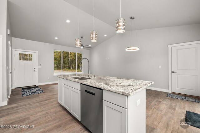 L12 Jasmine Rd, Chugiak, AK 99567 - kitchen with stainless steel dishwasher, a sink, lofted ceiling, baseboards, and light wood-type flooring