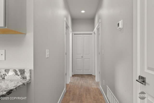 L12 Jasmine Rd, Chugiak, AK 99567 - corridor with light wood-style flooring, baseboards, and recessed lighting