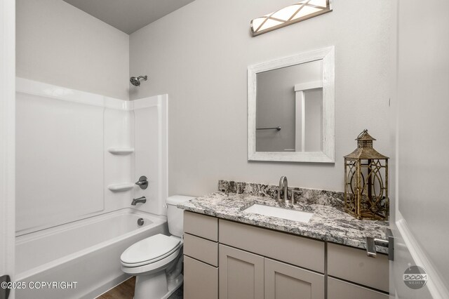 L12 Jasmine Rd, Chugiak, AK 99567 - bathroom with toilet, vanity, shower / washtub combination, and wood finished floors