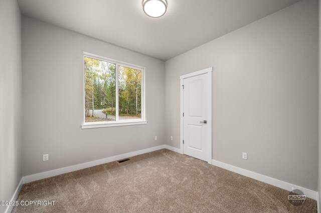 L12 Jasmine Rd, Chugiak, AK 99567 - empty room featuring carpet floors and baseboards