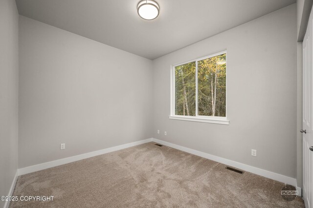 L12 Jasmine Rd, Chugiak, AK 99567 - carpeted spare room with baseboards