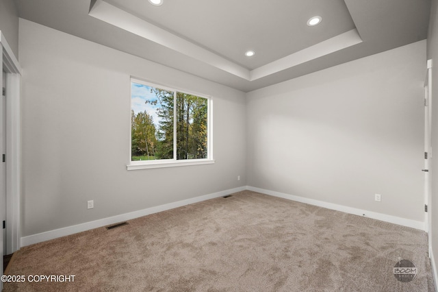 L12 Jasmine Rd, Chugiak, AK 99567 - carpeted empty room with a tray ceiling, recessed lighting, and baseboards