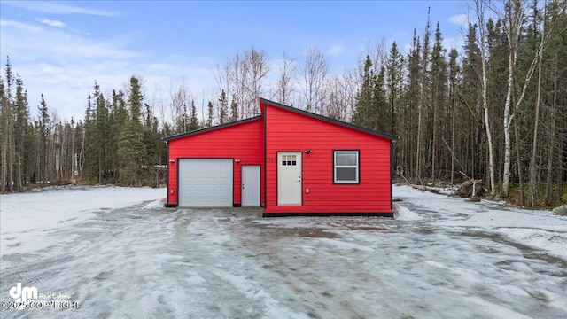 view of snow covered garage