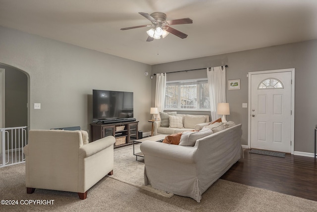 living room featuring ceiling fan and wood-type flooring