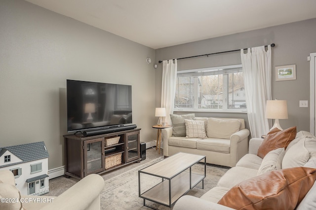 carpeted living room with a baseboard heating unit