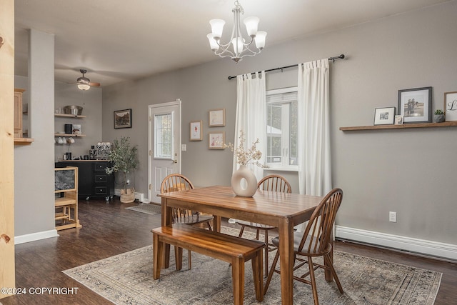 dining area with ceiling fan with notable chandelier, dark hardwood / wood-style floors, plenty of natural light, and baseboard heating