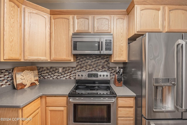 kitchen with backsplash, stainless steel appliances, and light brown cabinetry