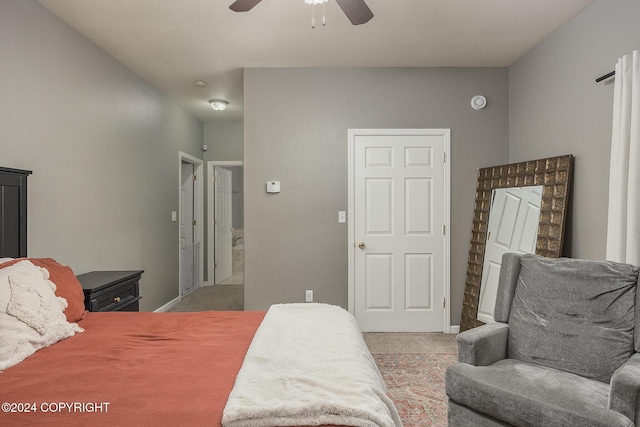 bedroom featuring ceiling fan and light colored carpet