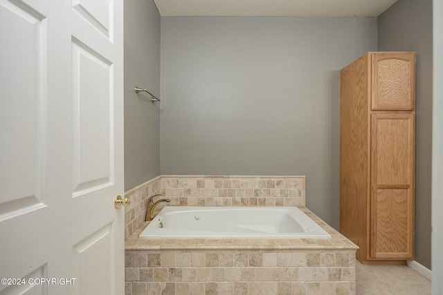 bathroom featuring tiled bath