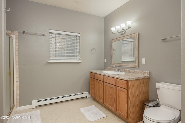 bathroom with vanity, a baseboard radiator, toilet, and walk in shower