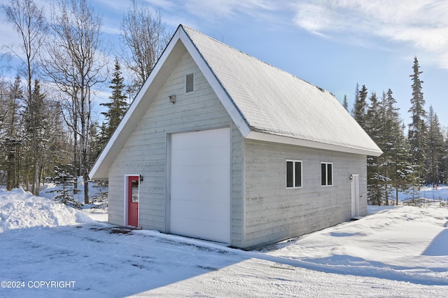 view of snow covered garage