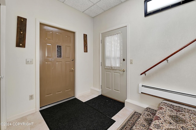 2795 Watergate Way, Kenai, AK 99611 - foyer entrance featuring a drop ceiling, light tile patterned floors, and a baseboard radiator
