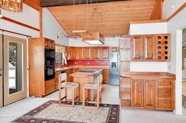 2795 Watergate Way, Kenai, AK 99611 - kitchen with black appliances, high vaulted ceiling, wood ceiling, light countertops, and a center island