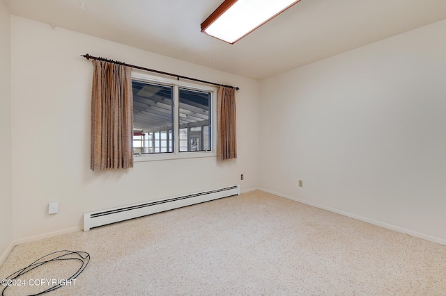 spare room featuring baseboard heating