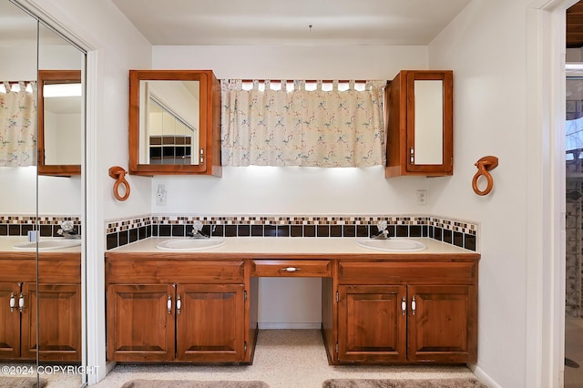 bathroom with vanity and tasteful backsplash