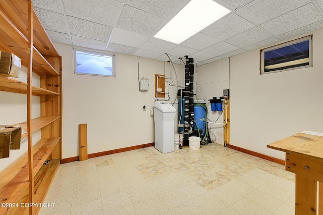 2795 Watergate Way, Kenai, AK 99611 - below grade area featuring tile patterned floors, a water softener, a paneled ceiling, and a water pressure tank