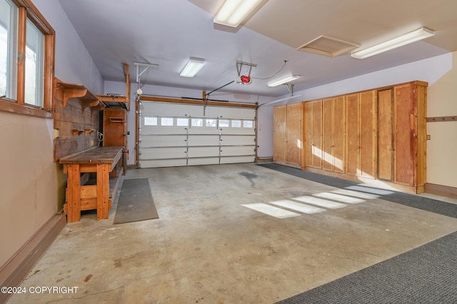 2795 Watergate Way, Kenai, AK 99611 - garage featuring a garage door opener and baseboards