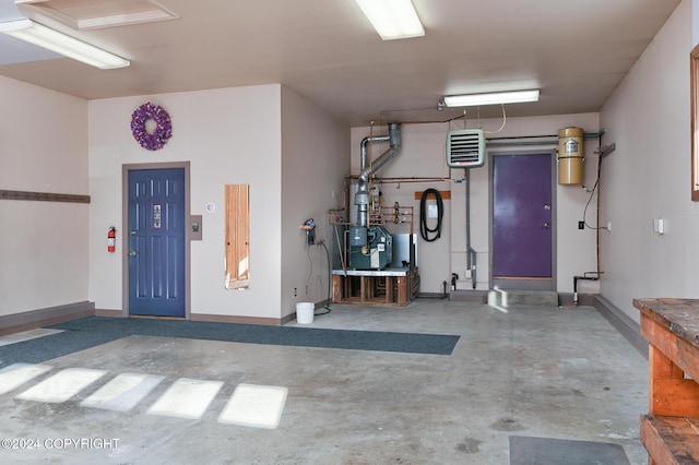 2795 Watergate Way, Kenai, AK 99611 - garage with a central vacuum unit and baseboards
