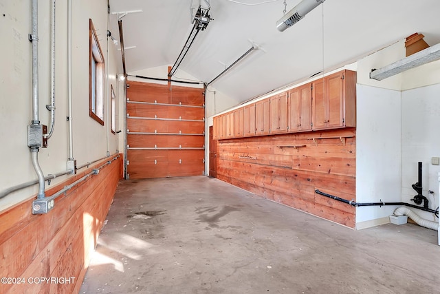 garage featuring wood walls