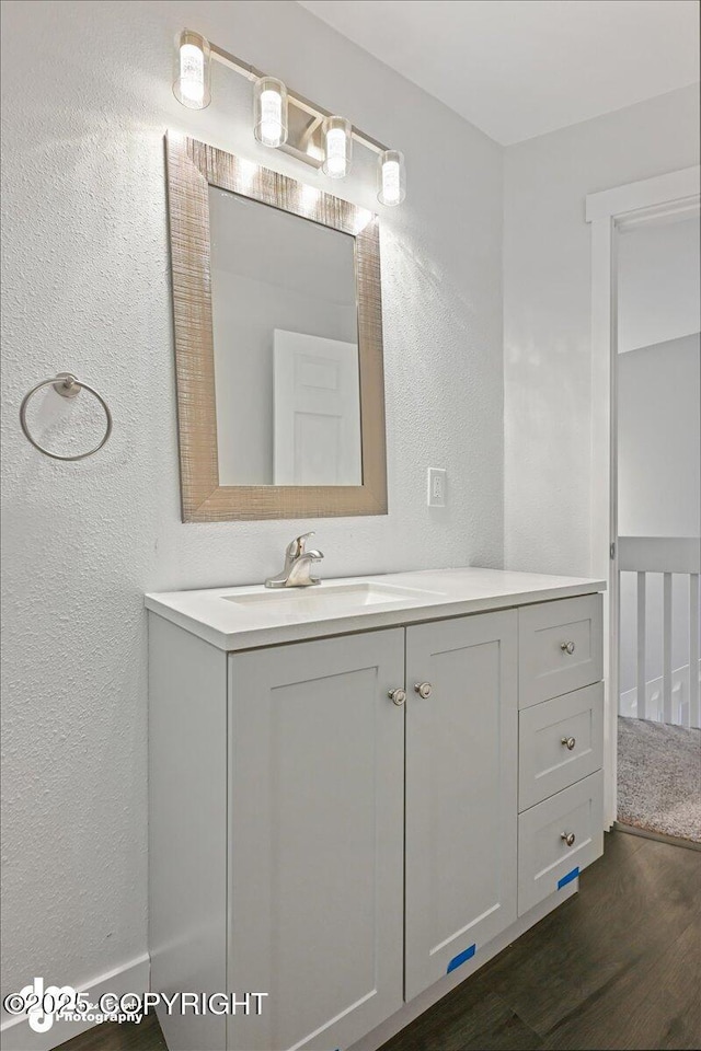 bathroom featuring hardwood / wood-style floors and vanity