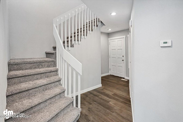 staircase featuring hardwood / wood-style flooring