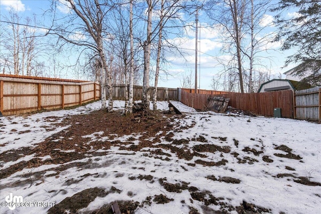 view of yard layered in snow