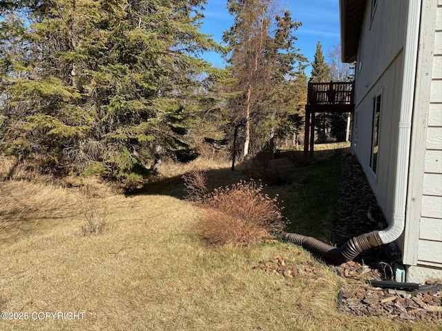 view of yard with a wooden deck