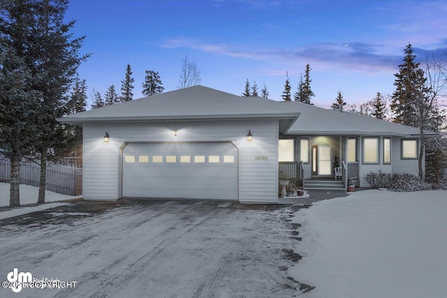 ranch-style home with a garage