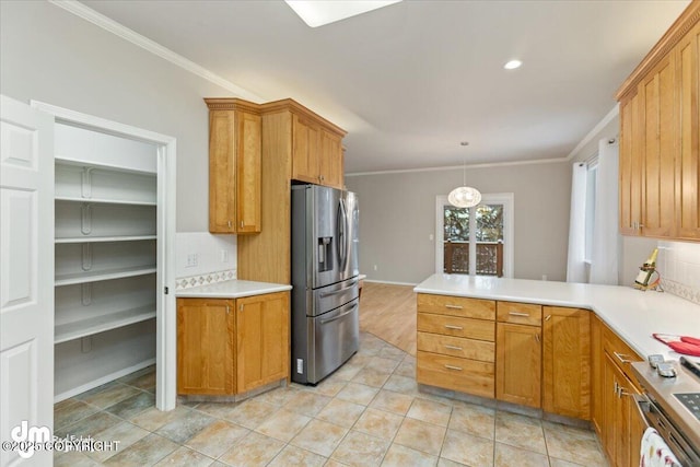 kitchen with kitchen peninsula, stainless steel fridge, tasteful backsplash, and crown molding