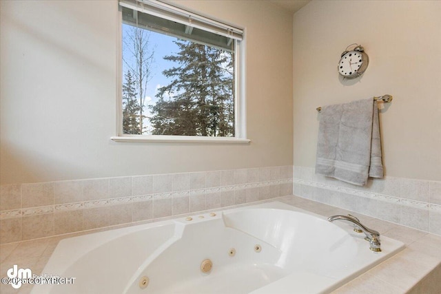 bathroom with a relaxing tiled tub