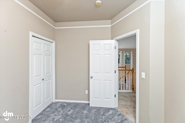 unfurnished bedroom featuring a closet and carpet floors