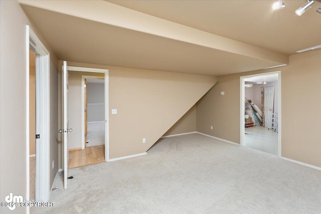 basement with light colored carpet