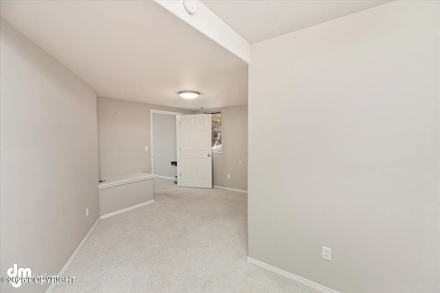 spare room with light colored carpet