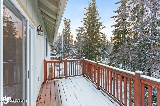 view of snow covered deck