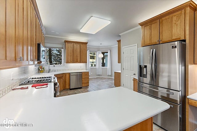 kitchen with kitchen peninsula, light tile patterned floors, stainless steel appliances, and ornamental molding