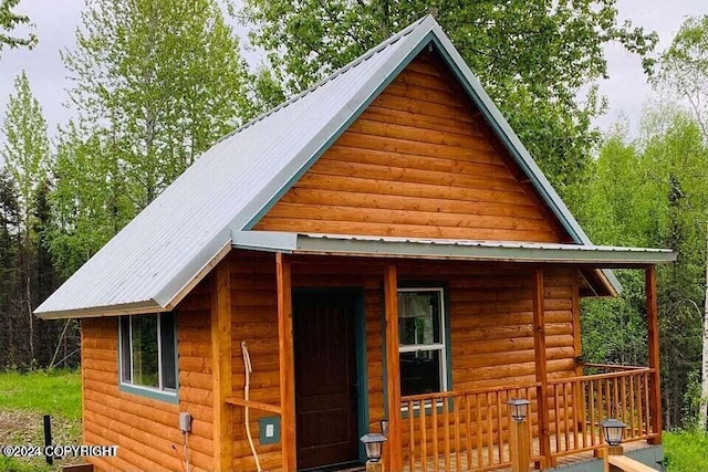 view of outbuilding featuring covered porch