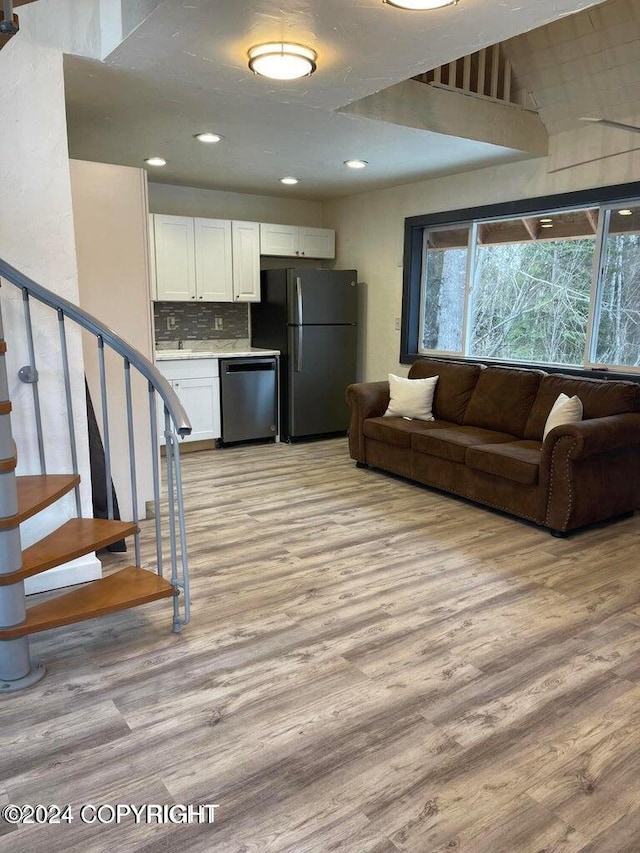 living room with light hardwood / wood-style flooring