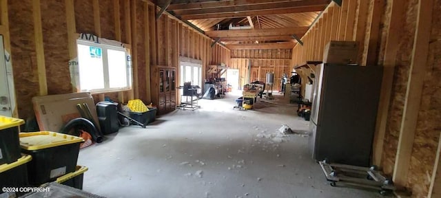 miscellaneous room featuring lofted ceiling