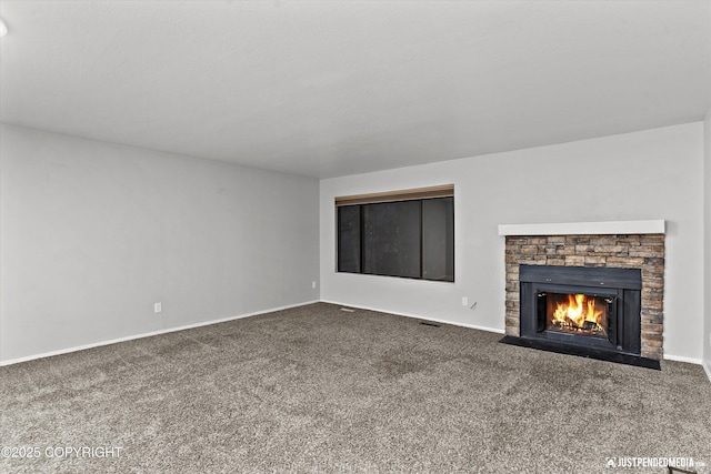 unfurnished living room featuring carpet and a fireplace