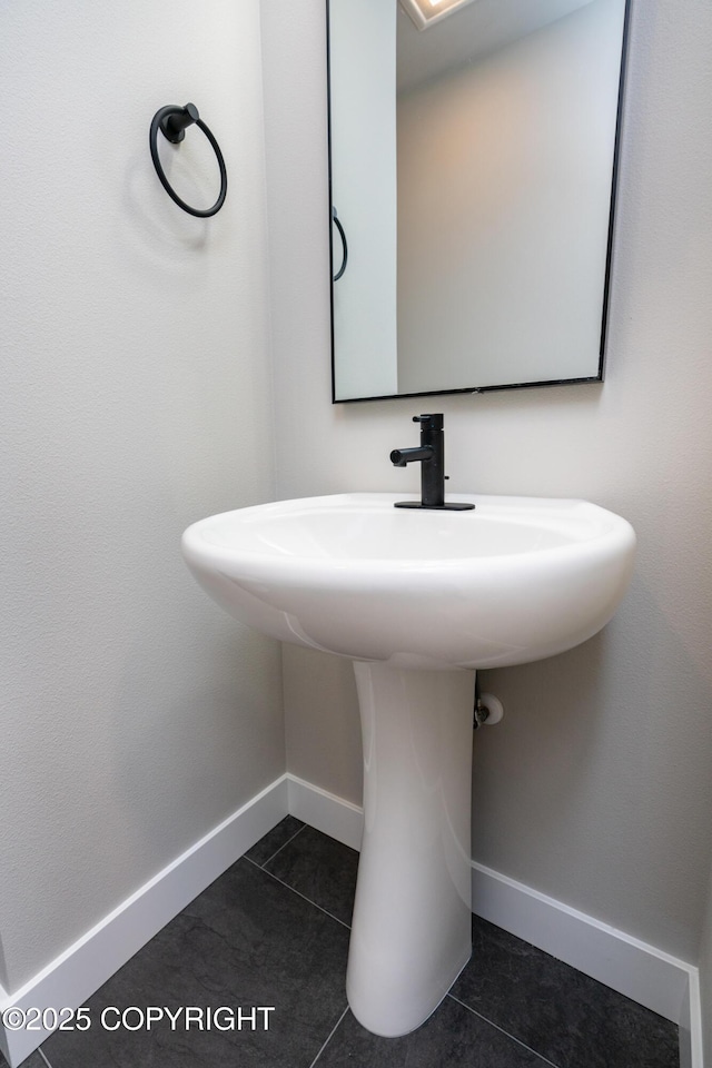 bathroom with tile patterned flooring and sink