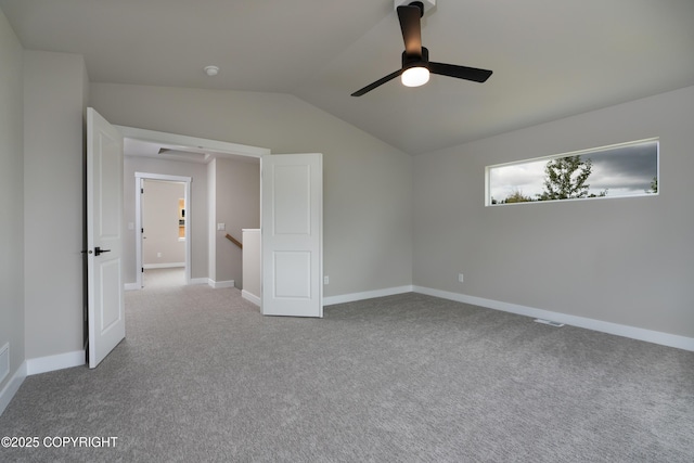 unfurnished bedroom featuring light colored carpet, ceiling fan, and lofted ceiling