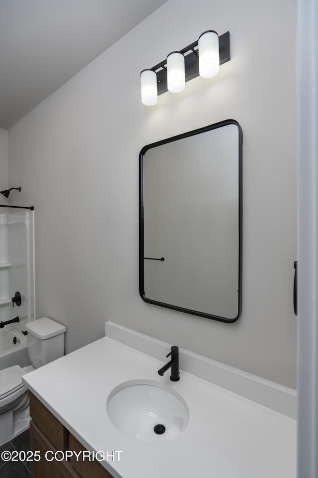 full bathroom with toilet, vanity, and tub / shower combination