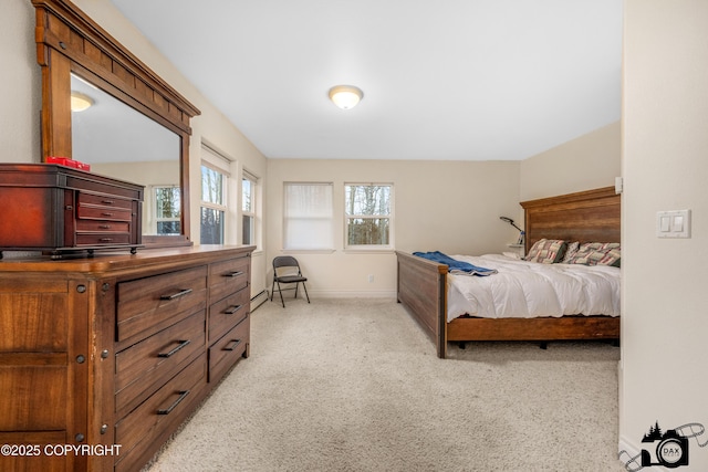 bedroom with light colored carpet